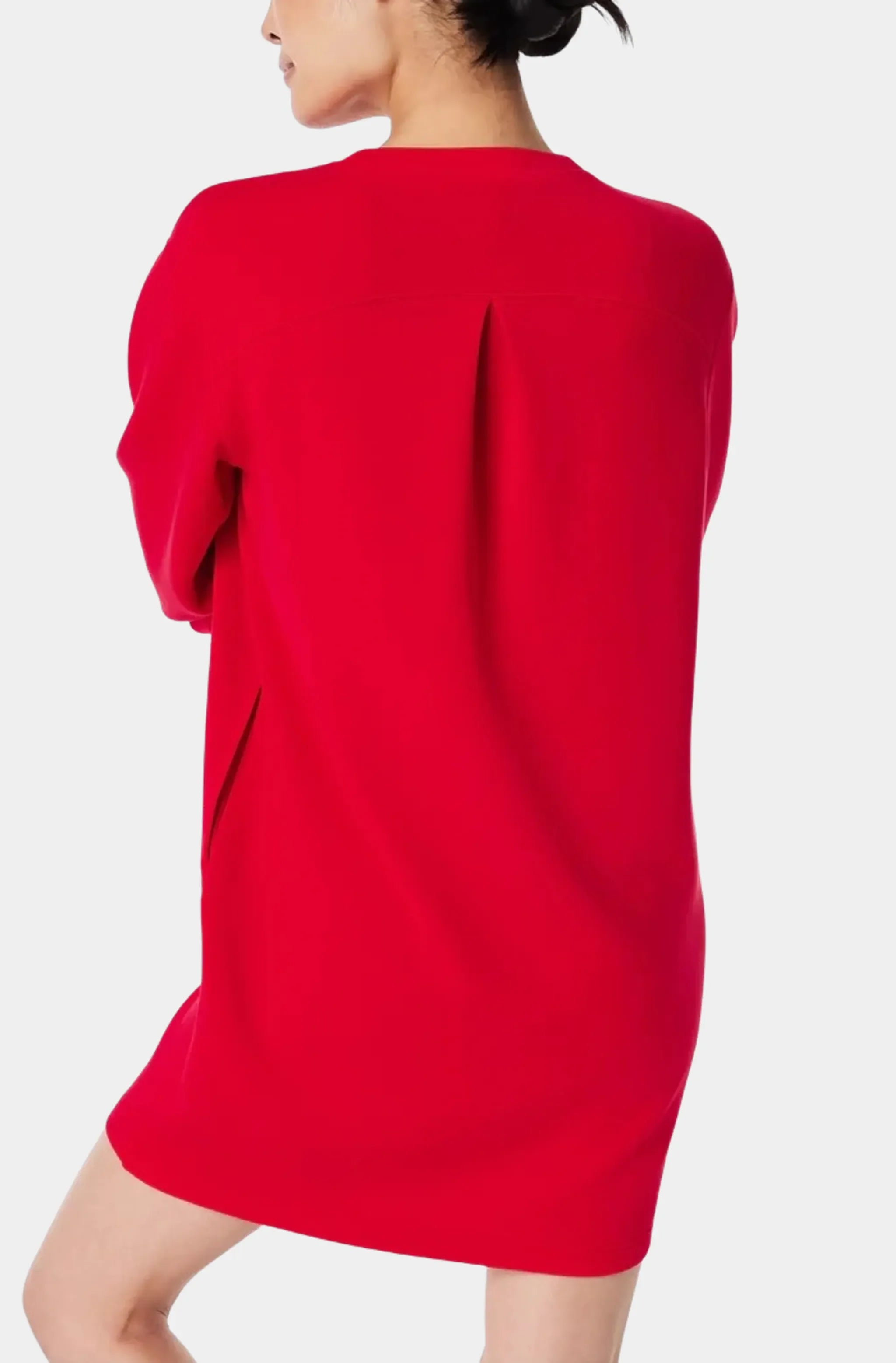 Back view of red crew neck dress with pleat detail