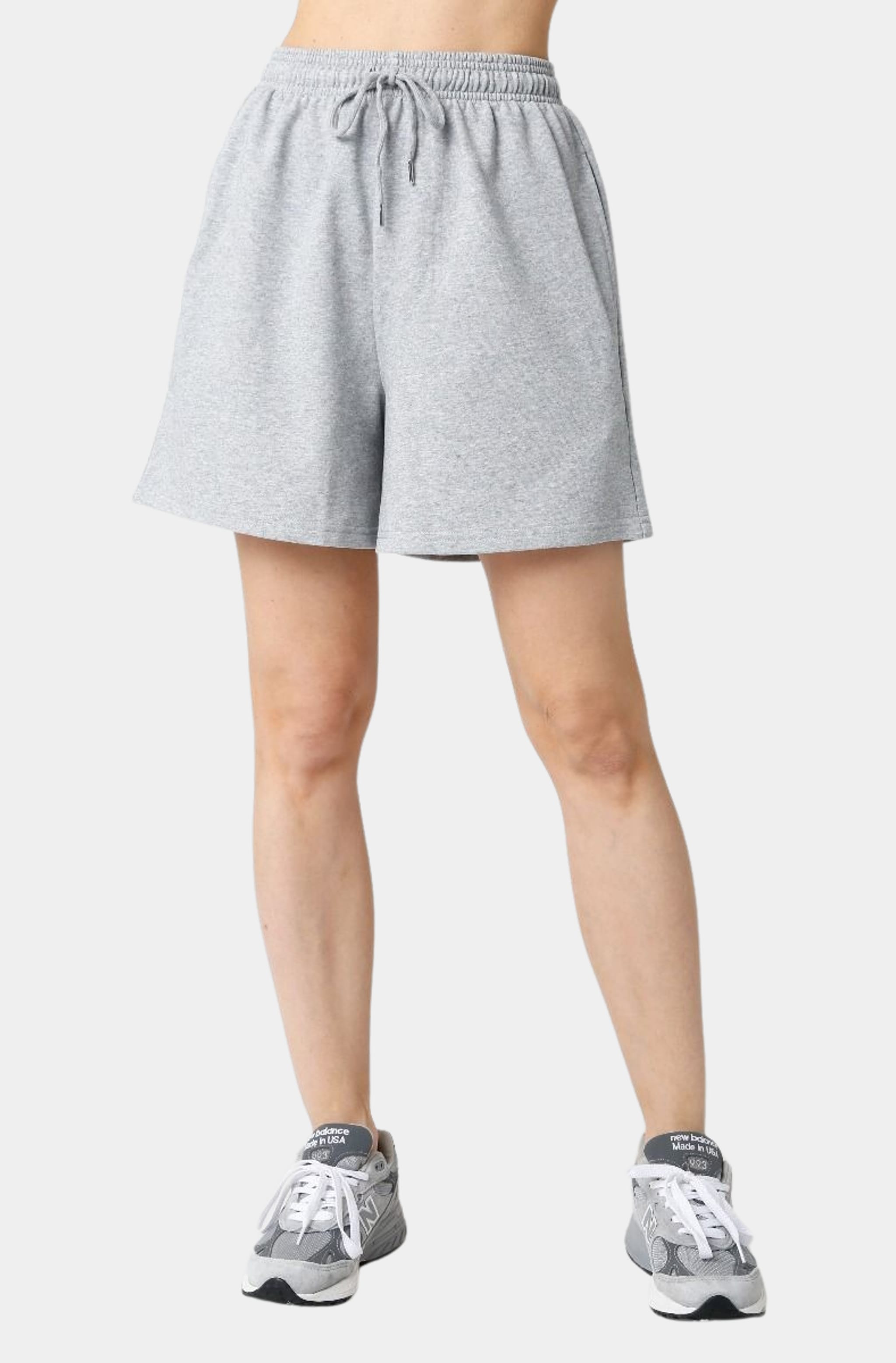 Front view of gray Allison Shorts with sneakers