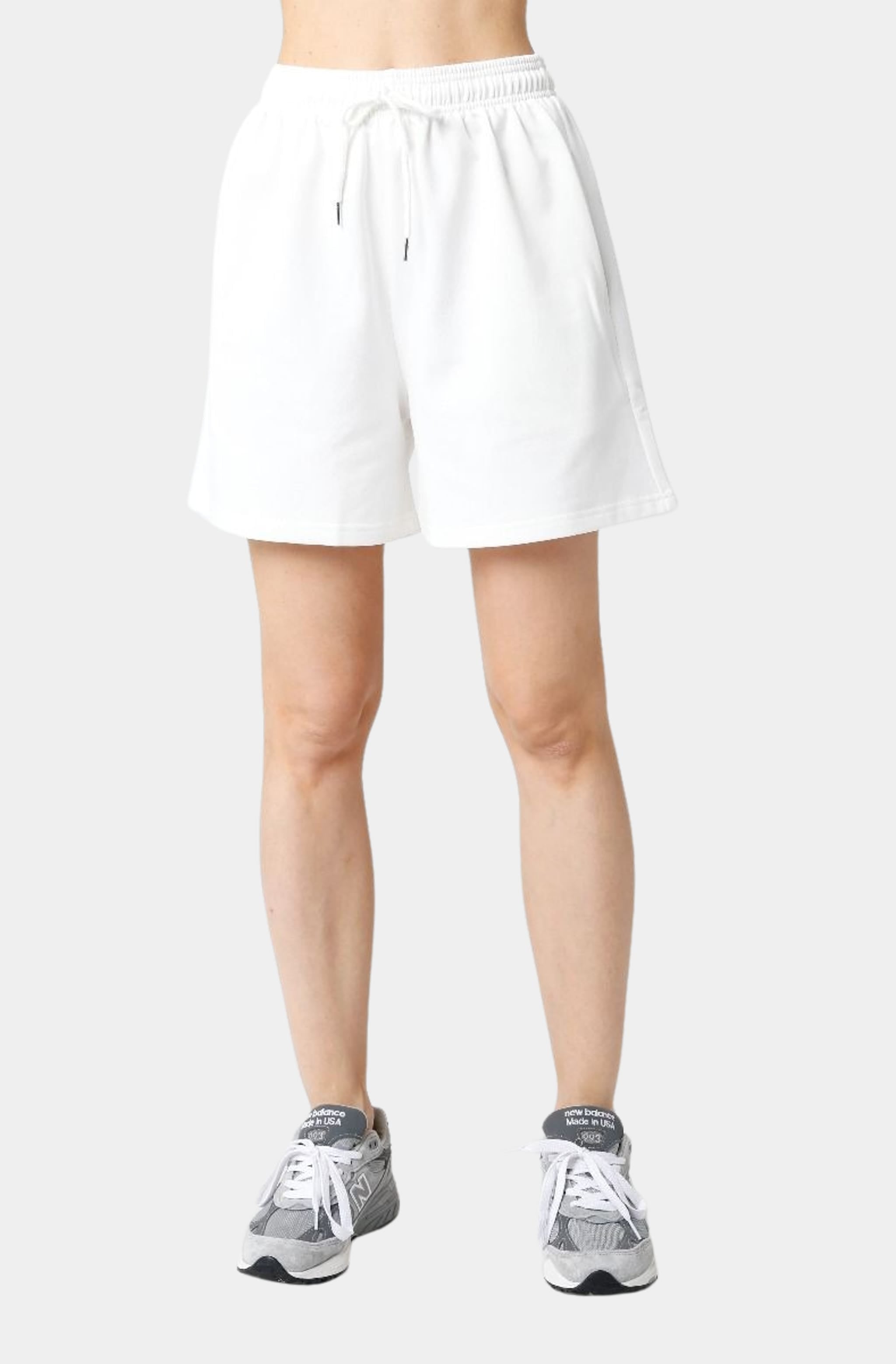 Front view of white Allison Shorts with sneakers