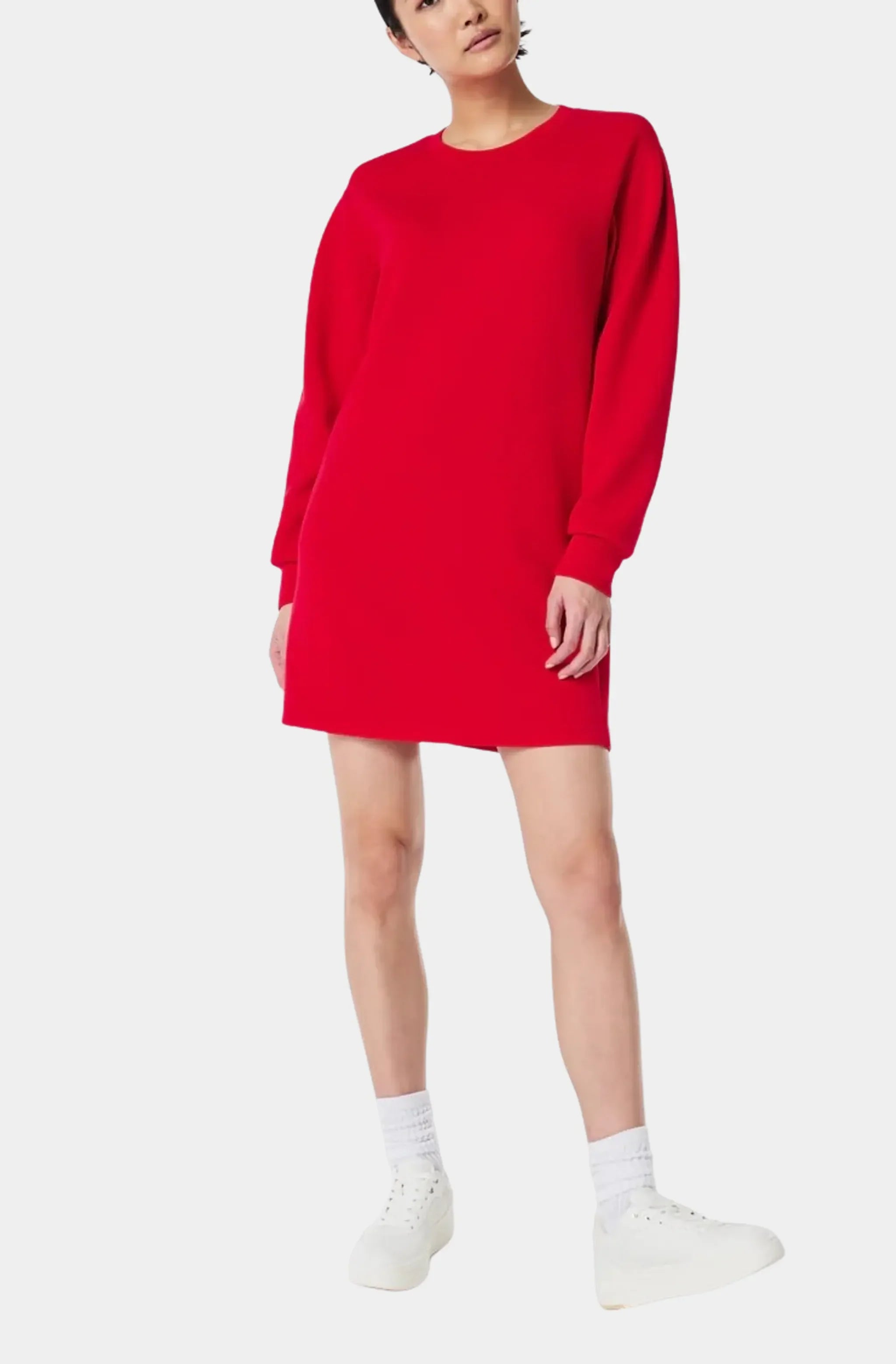 Red crew neck dress with long sleeves and sneakers