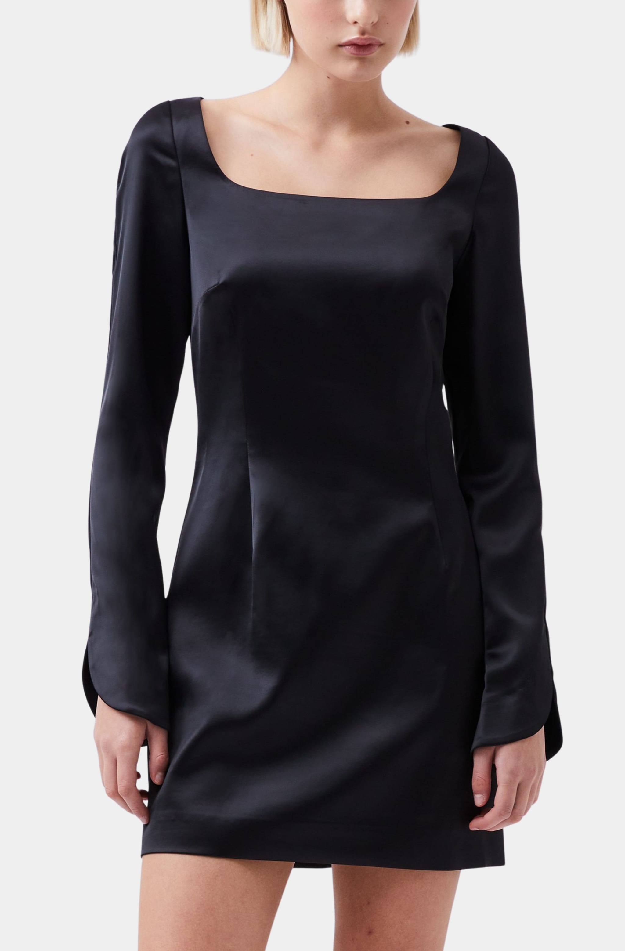 Close-up of black satin scoop neck dress with long sleeves