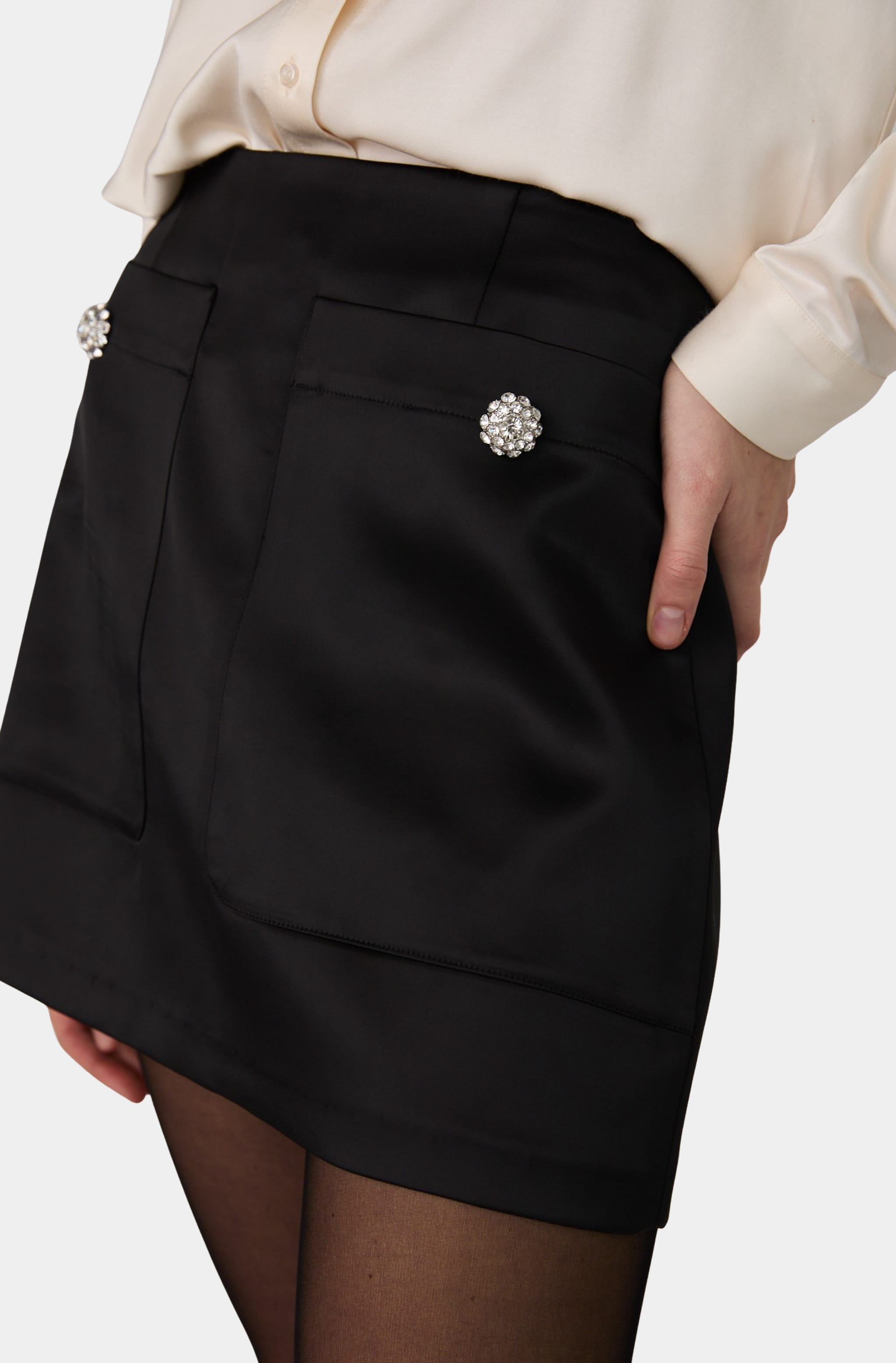 Close-up of Carey Satin Embellished Skirt with decorative pockets