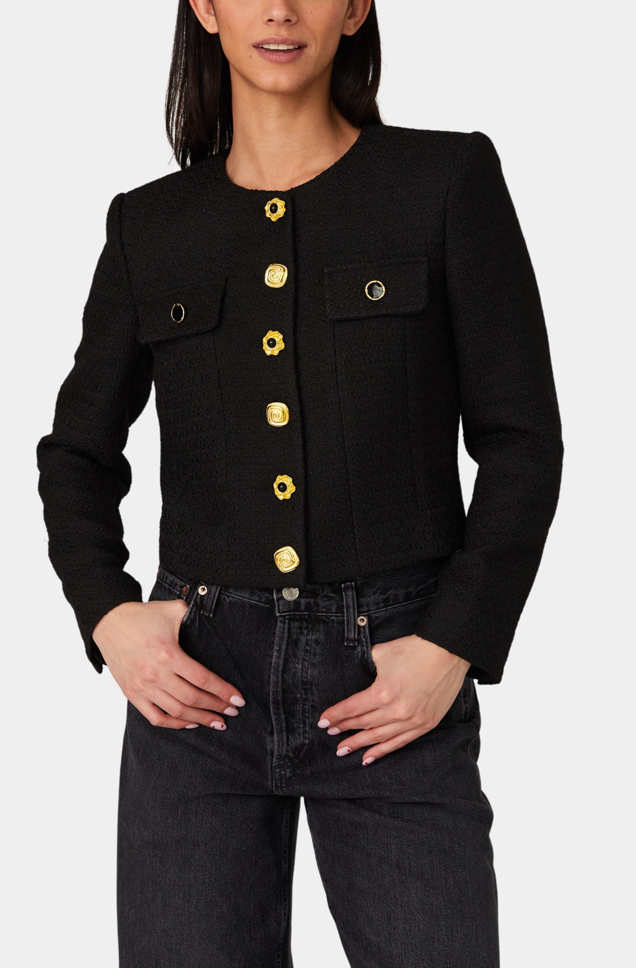 Black structured jacket with gold buttons, angled view.