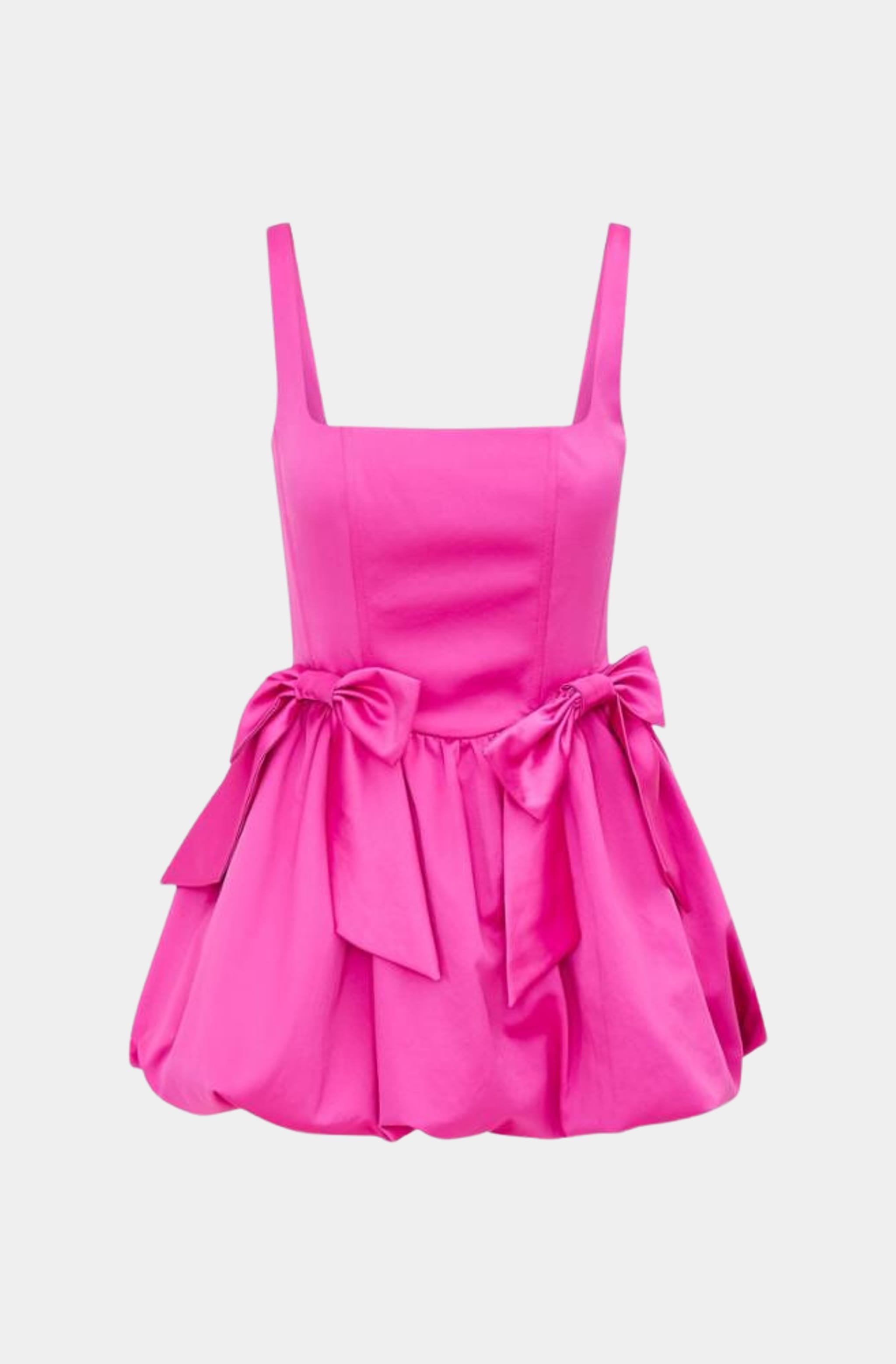 Front view of Bayer Dress, pink mini with bow embellishments.