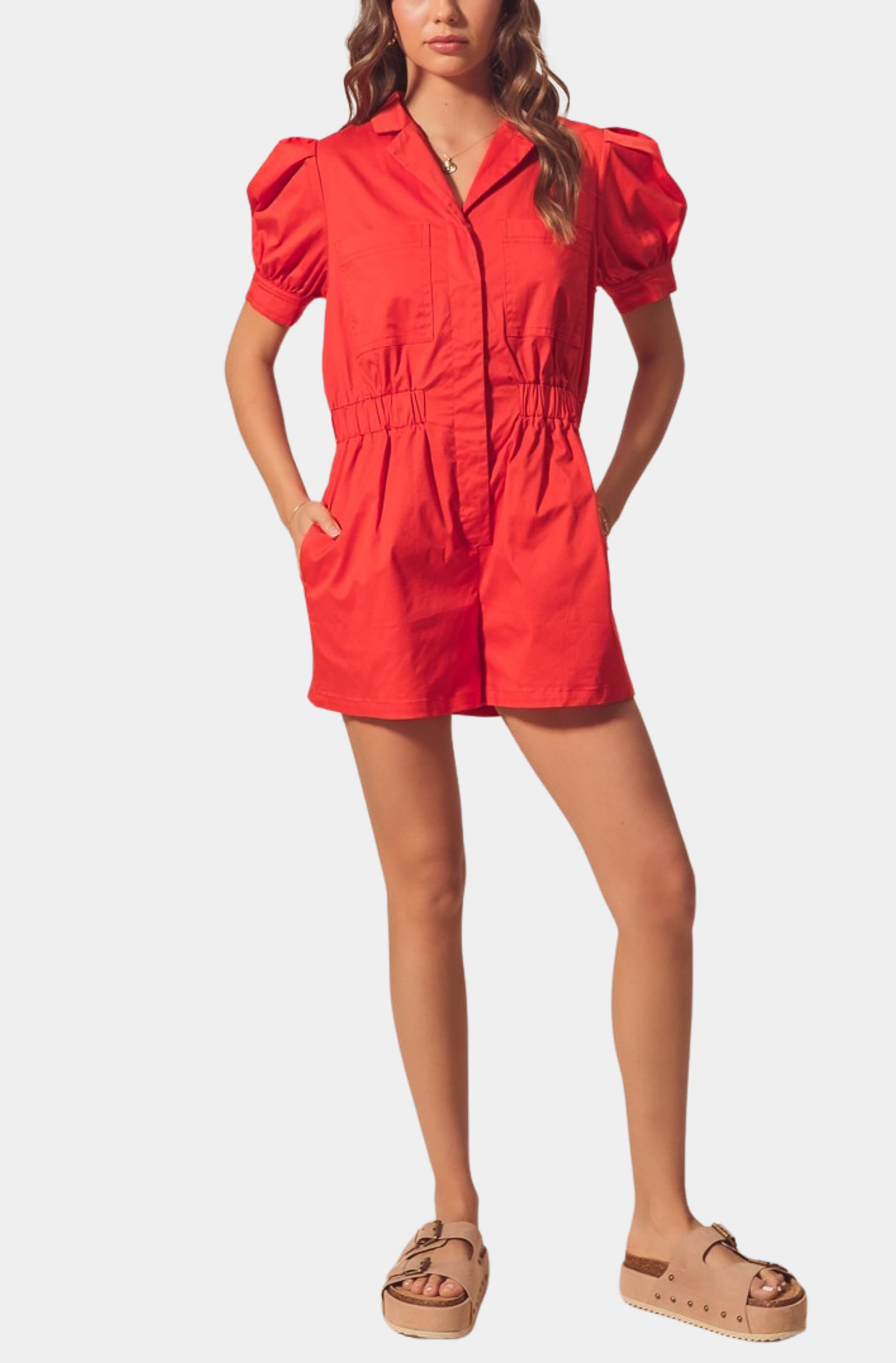 Full view of red Harlow Romper, casual game day style