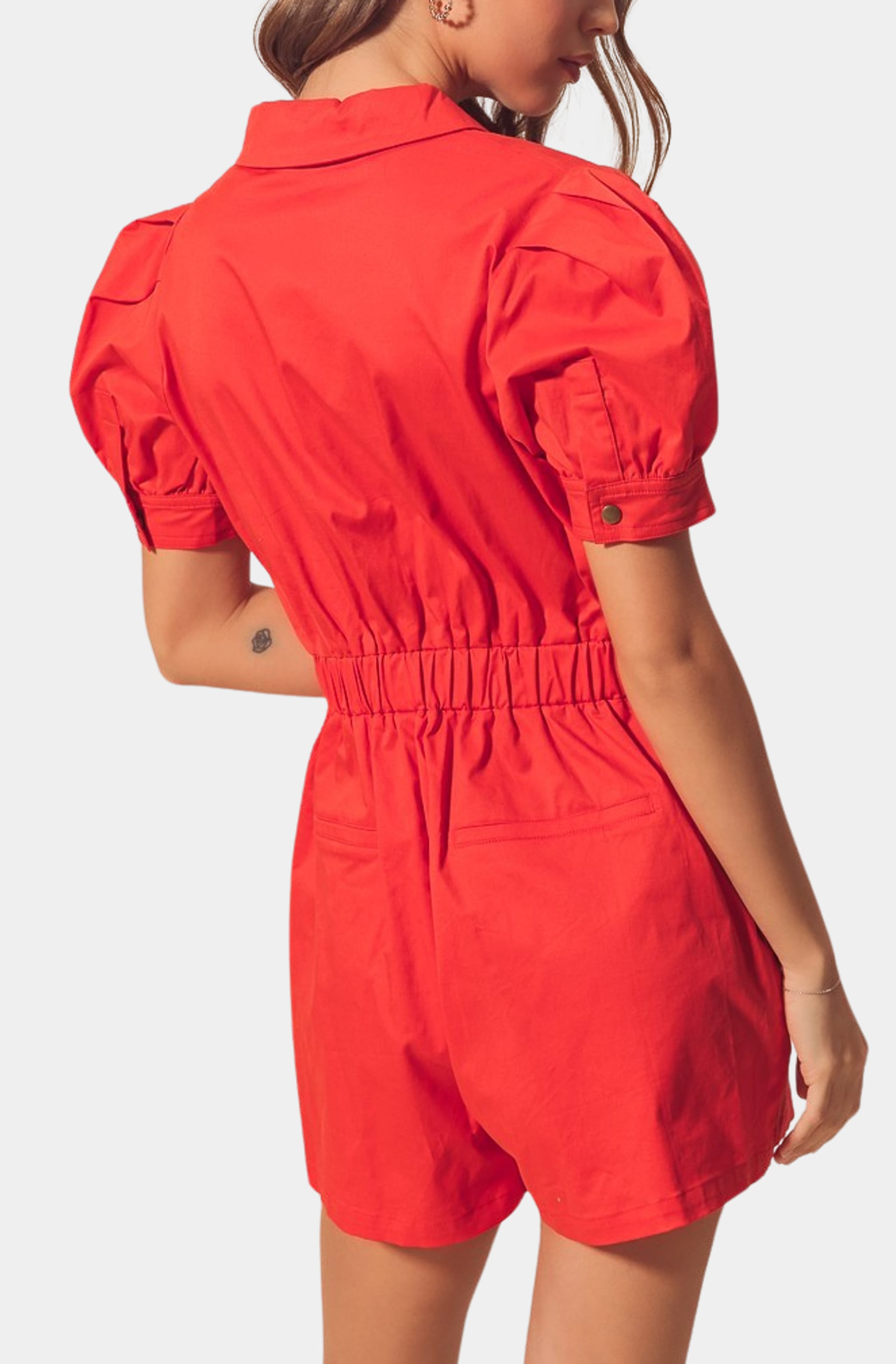 Back view of red Harlow Romper with puff sleeves