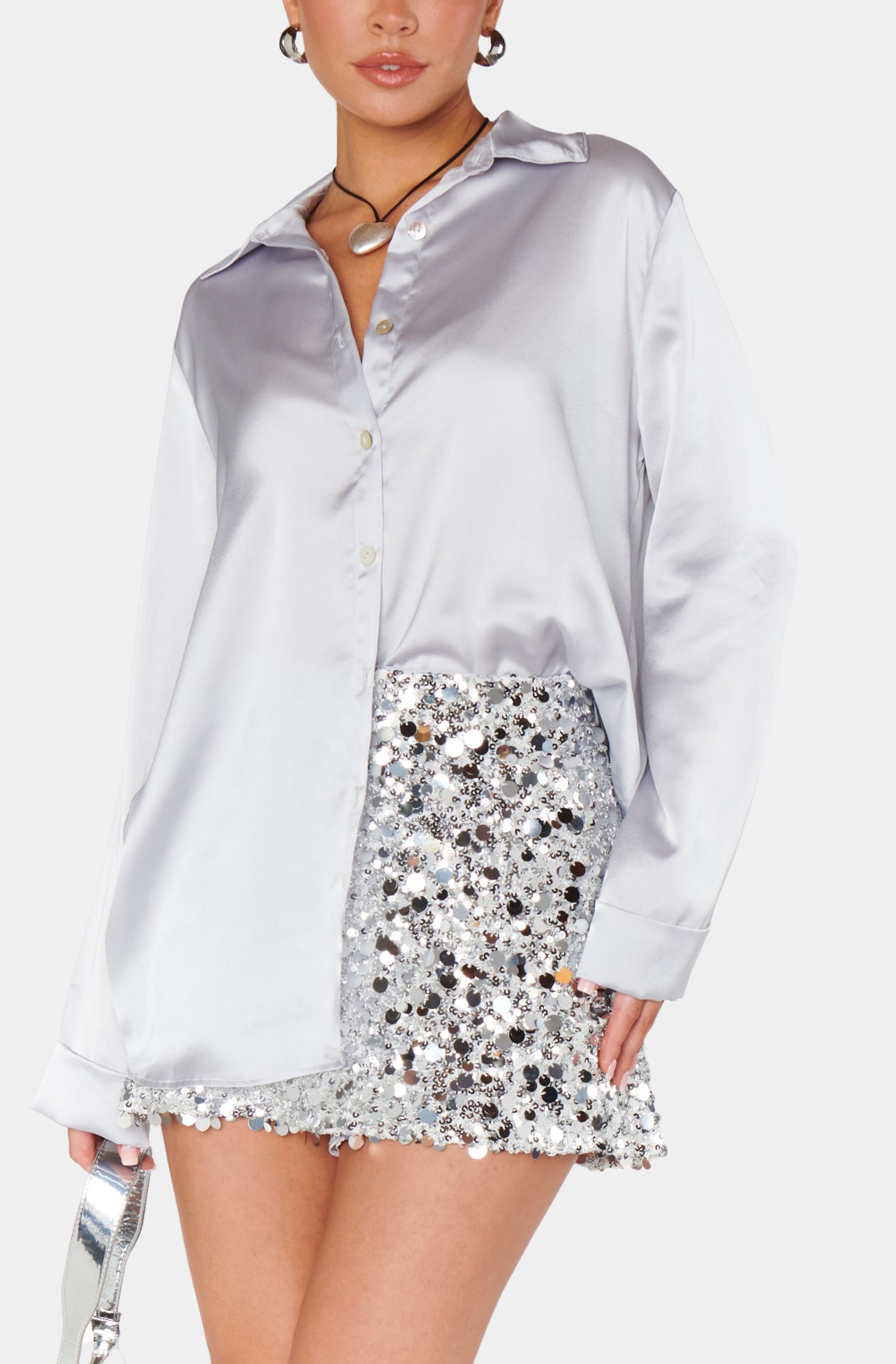 Close-up of Smith Button Down with sequin skirt.