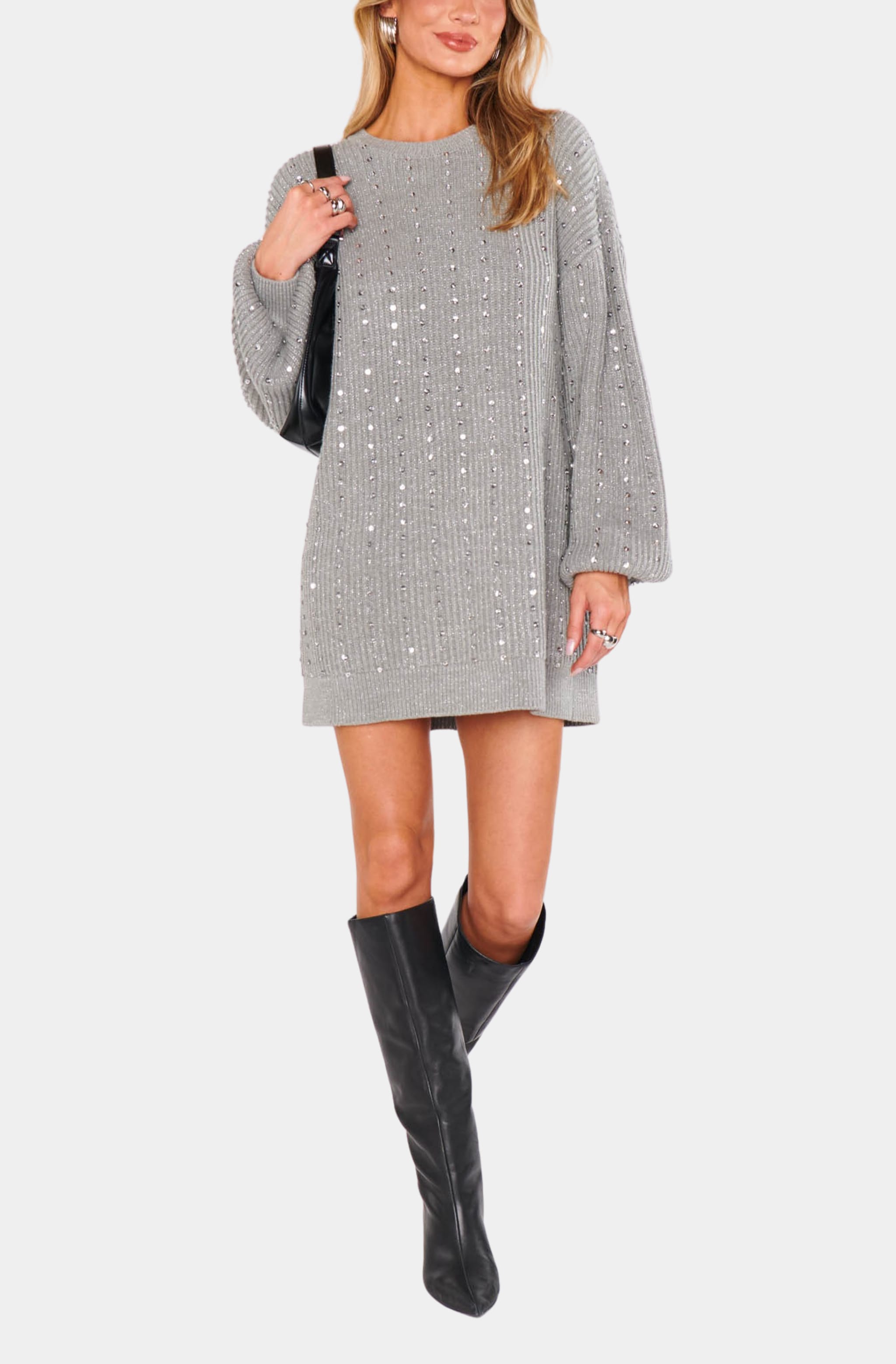 Model wearing sequin Social Sweater Dress with black boots