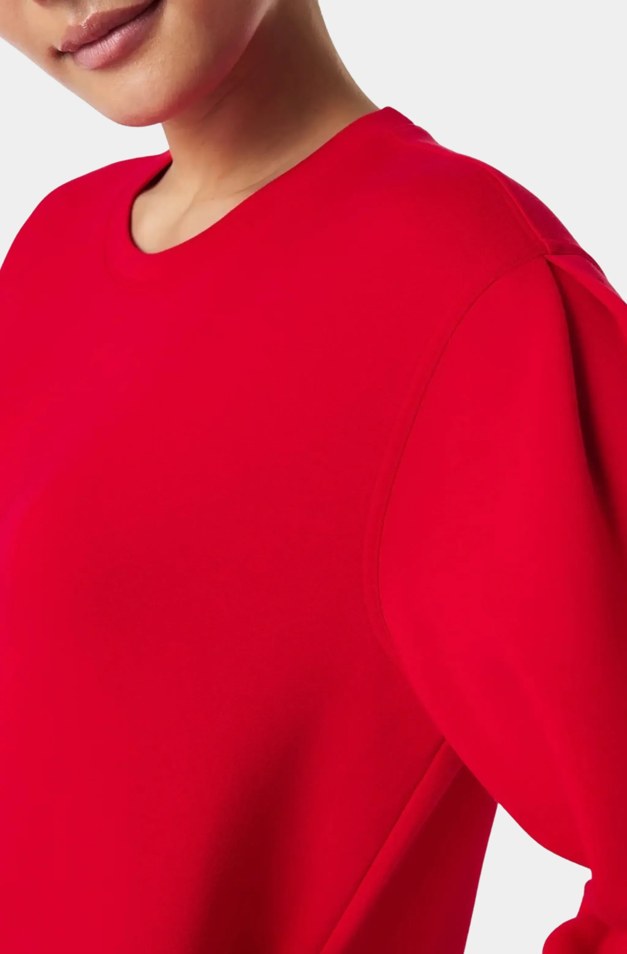 Close-up of red crew neck dress shoulder