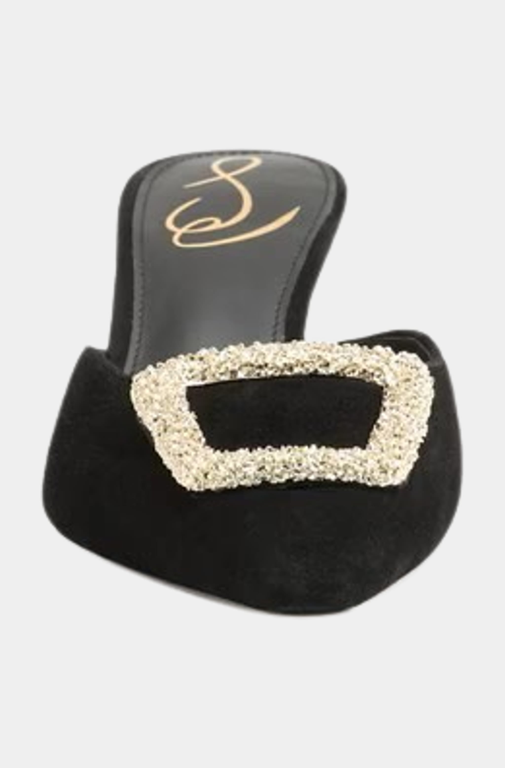 Front view of black mule with large gold buckle